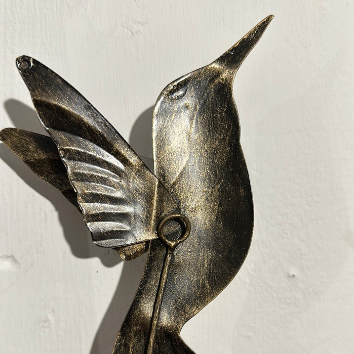 Back view of handmade copper humming bird wall hook.
