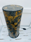 aerial close up of mosaic cylinder lamp with light off