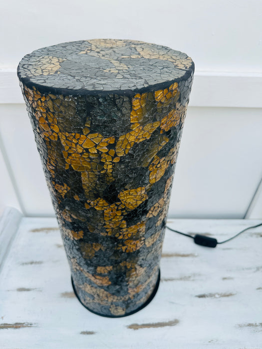aerial close up of mosaic cylinder lamp with light off