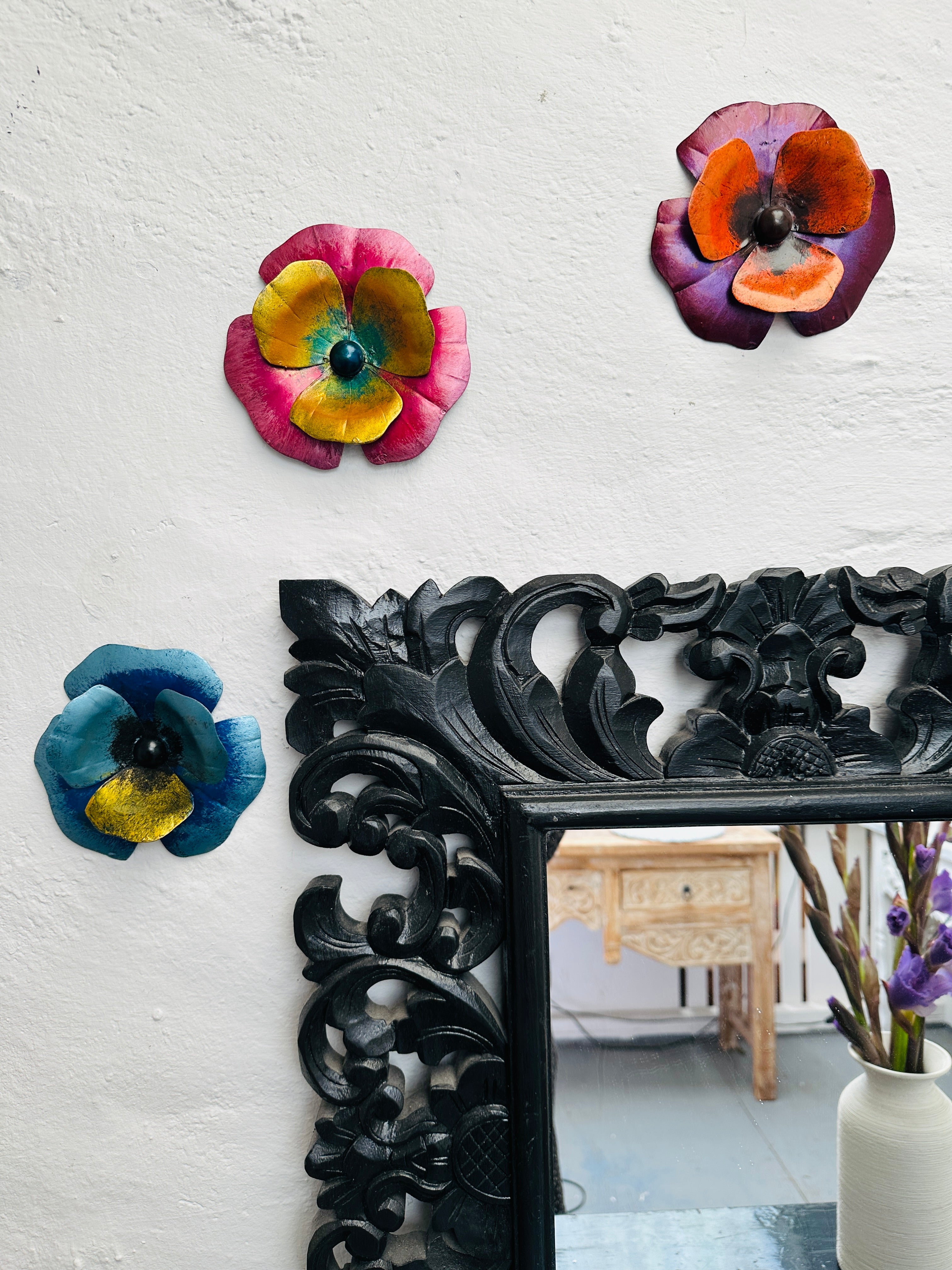 display view of pansy flowers attached to wall