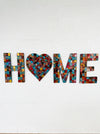 front view of mosaic home on wall