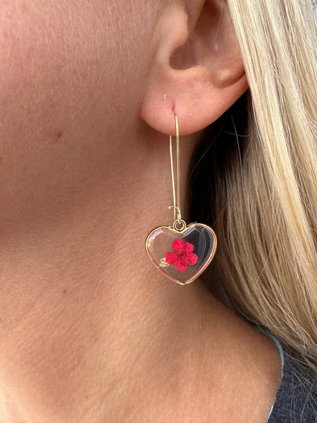 close up of earring on model