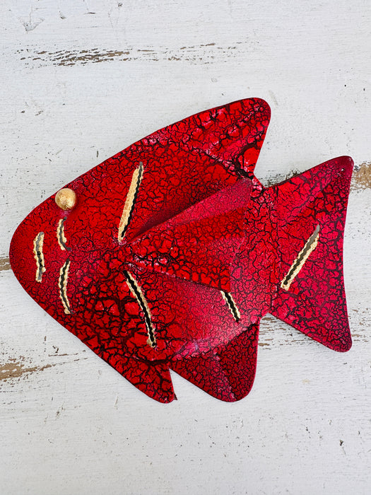 aerial view of metal fish in red