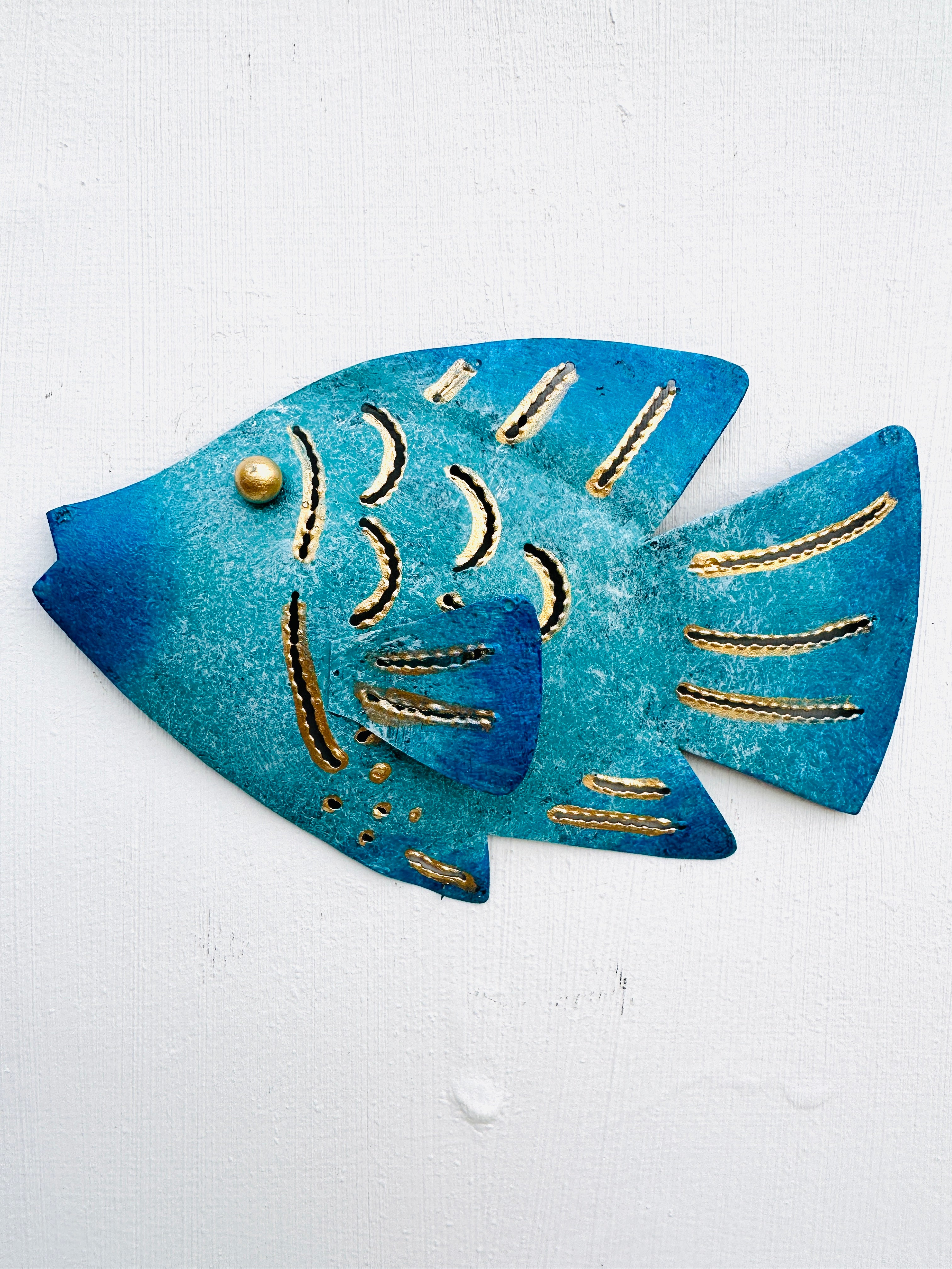 front view of metal reef fish in blue