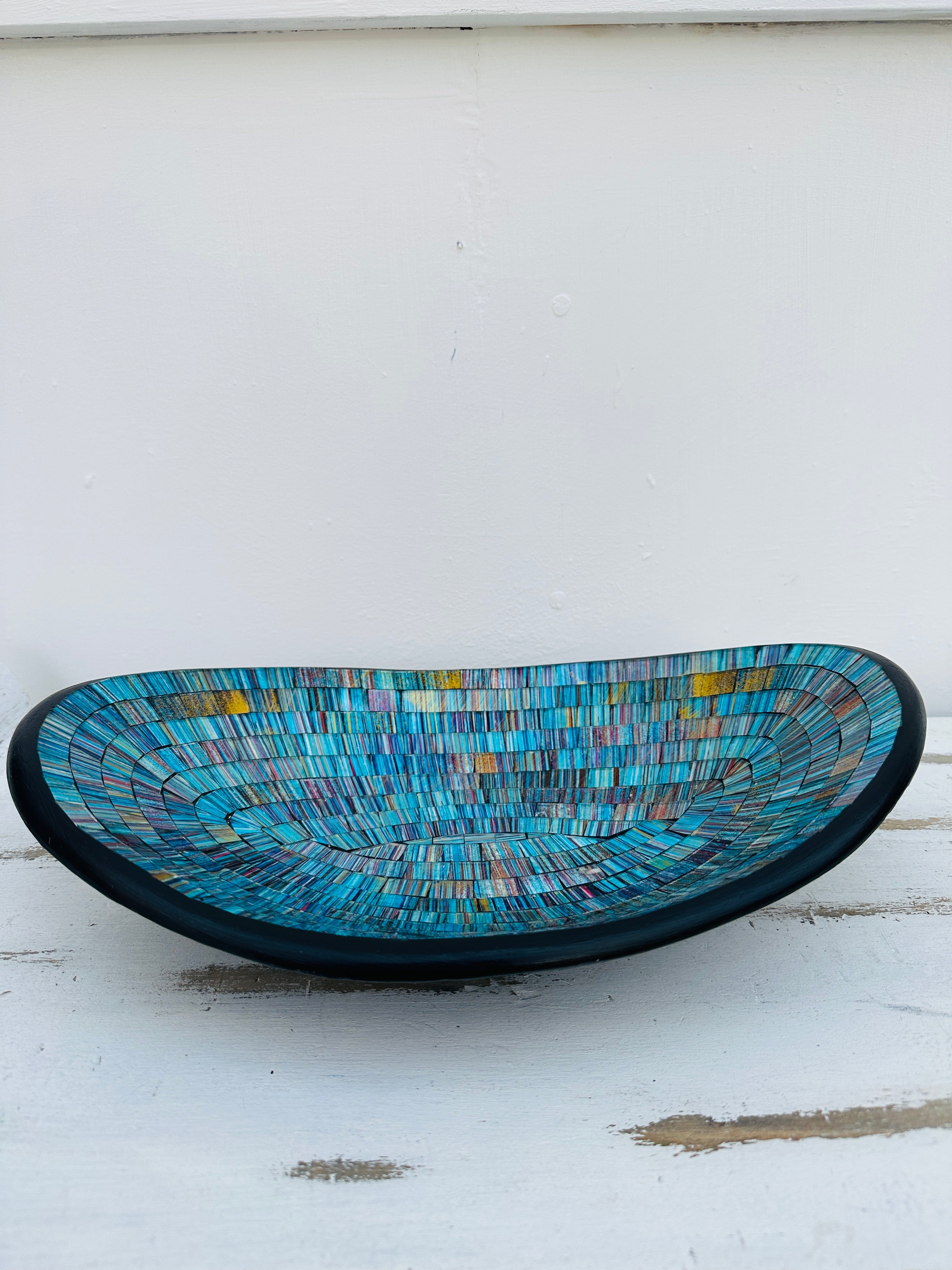 side view of mosaic oval bowl on white background
