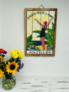 display view of antilles sign with a vase of flowers