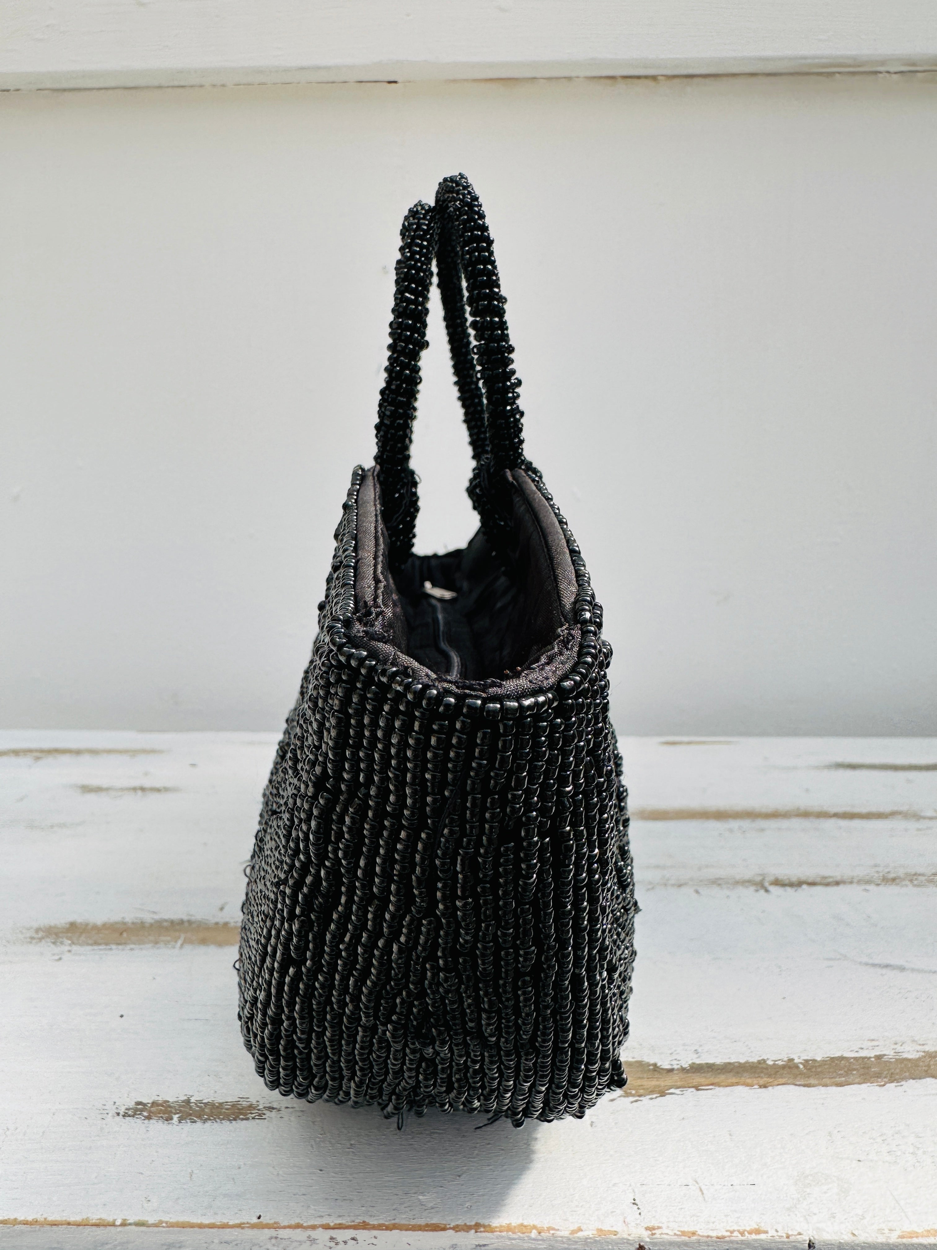side view of beaded handbag in black