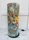 front view of mosaic cylinder lamp with light on