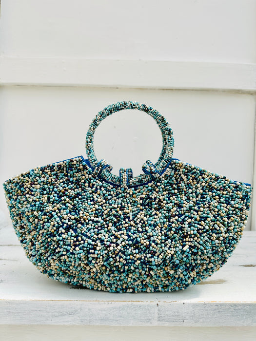 front view of beaded handbag in turquoise 