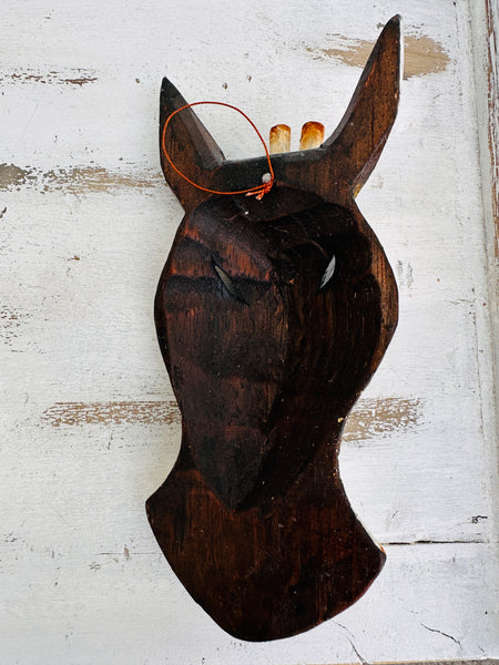 aerial base view of wooden giraffe mask