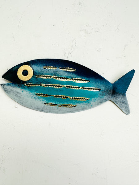 front view of mottled fish in blue