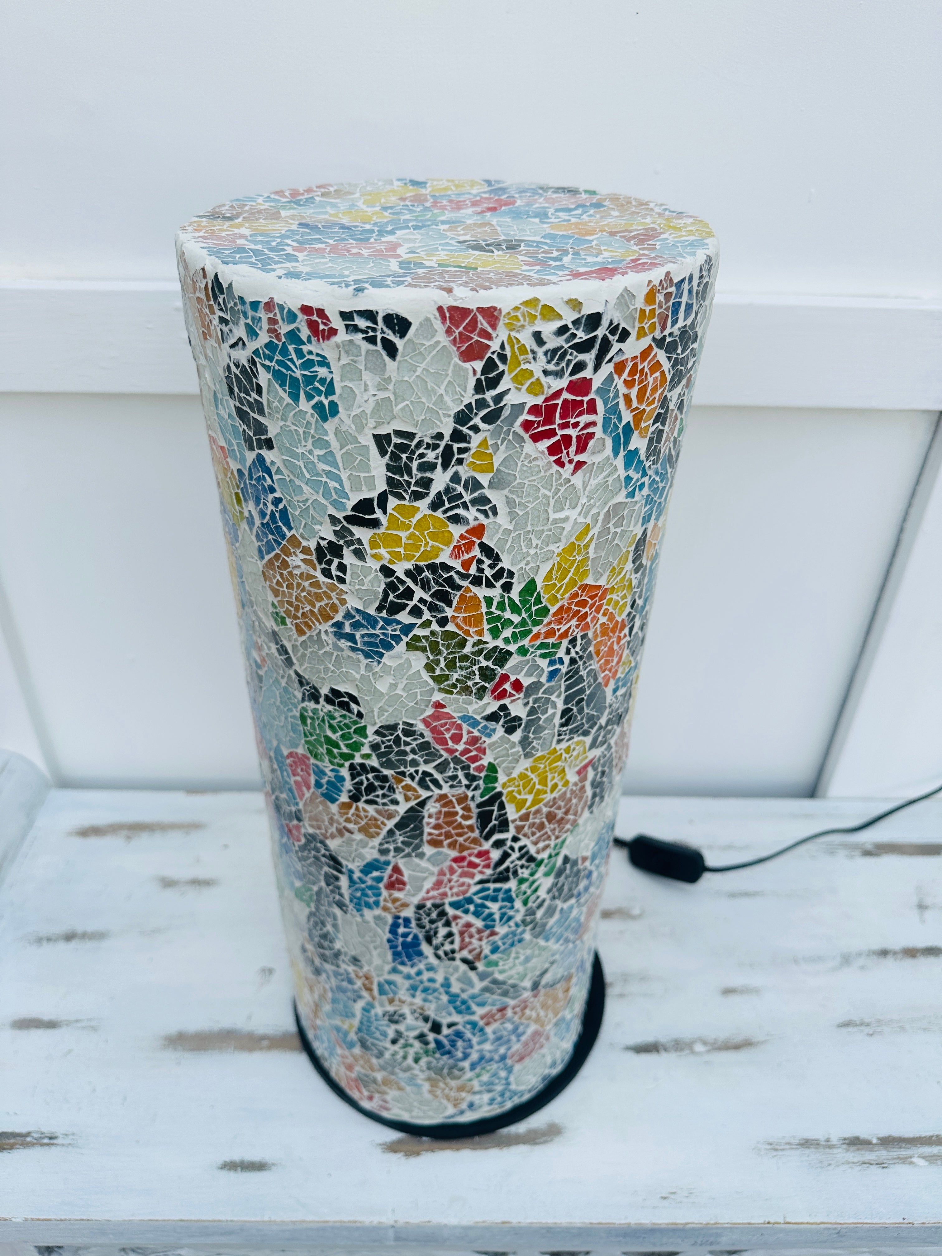 close up of glass mosaic cylinder lamp with light off