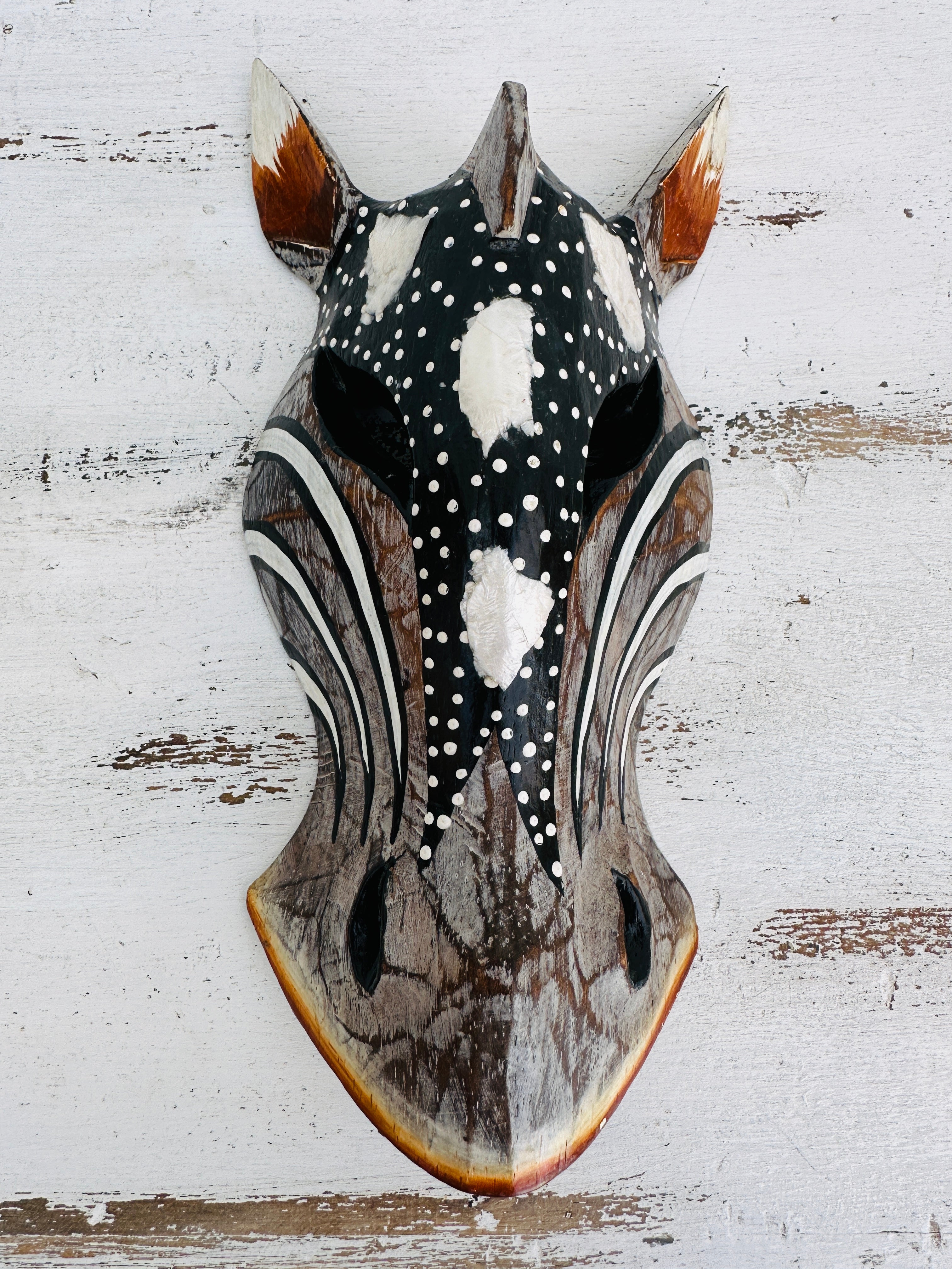 aerial view of wooden zebra mask