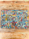aerial view of single mosaic placemat on wooden surface