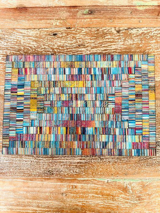 aerial view of single mosaic placemat on wooden surface