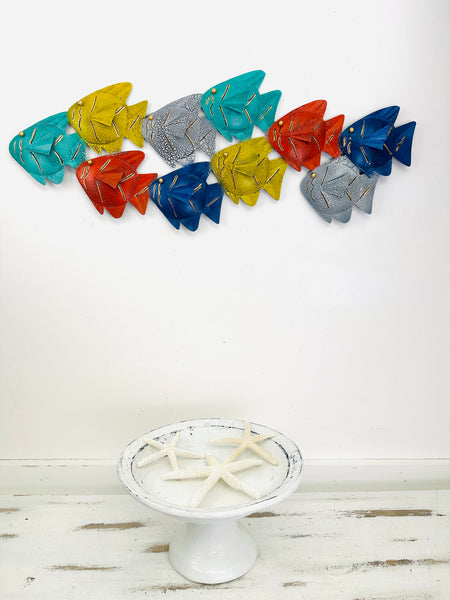 display view of shoal of colour fish on a wall