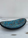 side view of oval mosaic bowl in blue