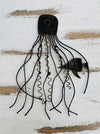 Back of blue jellyfish metal wall art showing metal structure and hanging point