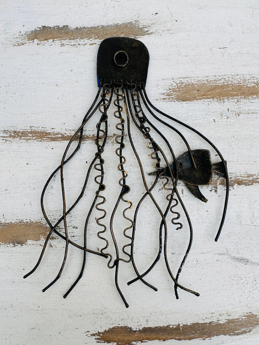 Back of blue jellyfish metal wall art showing metal structure and hanging point