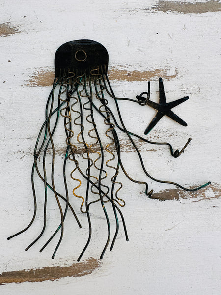 Back of metal jellyfish wall decoration showing hanging eyelet and metal structure