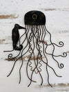 Back of copper jellyfish metal wall decoration showing hanging eyelet and metal shaping