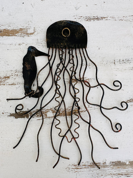 Back of copper jellyfish metal wall decoration showing hanging eyelet and metal shaping