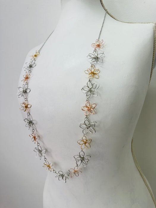 Necklace with floral designs on a mannequin