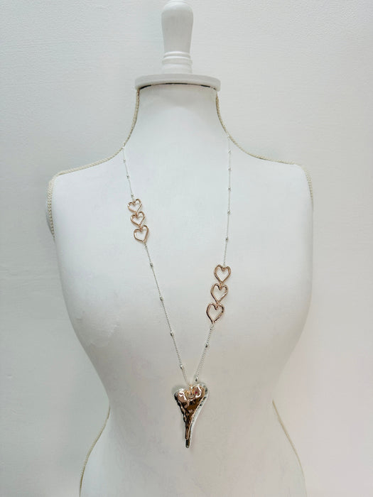 Necklace with heart pendants on a mannequin 