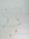front of long silver chain station necklace with acrylic faux-shell circles 