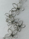 detail of silver floral necklace 