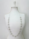 Silver floral necklace on a mannequin 