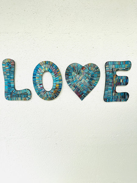 front view of mosaic love attached on wall
