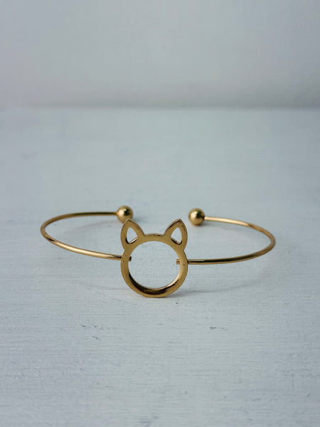 Minimalist gold-tone cat silhouette racelet with open bangle design