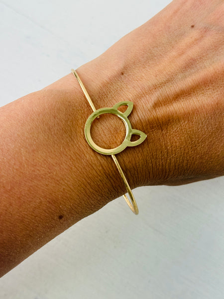 Minimalist gold-tone cat silhouette racelet with open bangle design