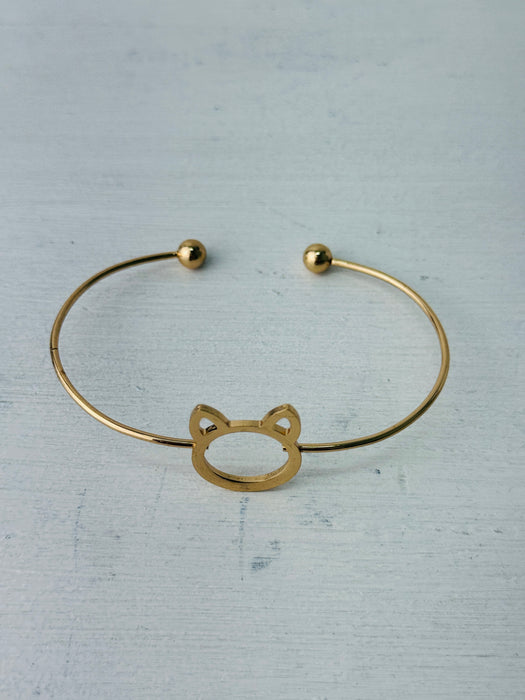 Minimalist gold-tone cat silhouette racelet with open bangle design