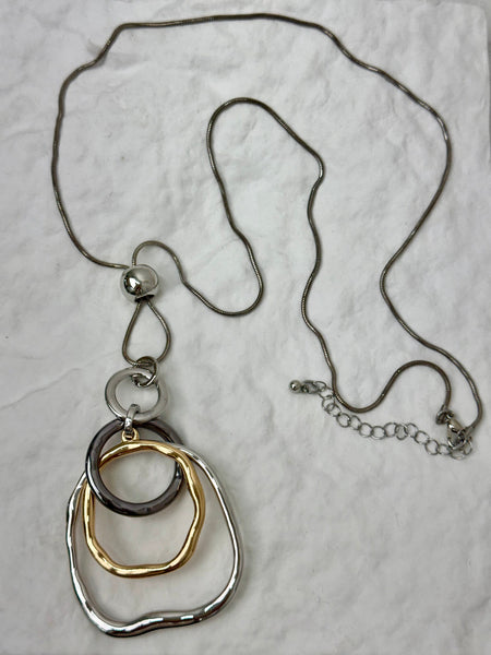 Necklace with three interlocking rings on a light gray background