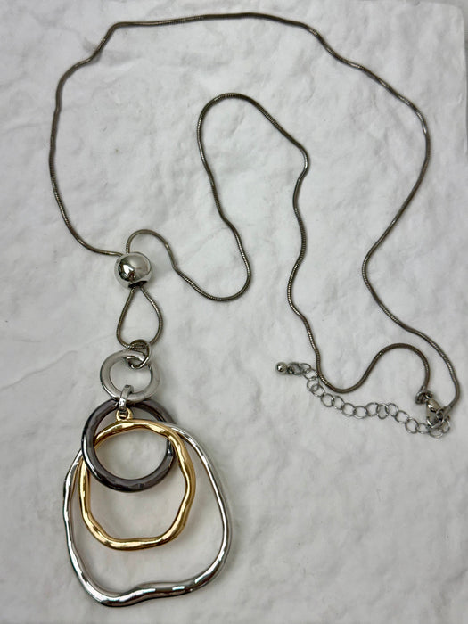 Necklace with three interlocking rings on a light gray background