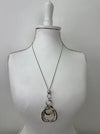 Mixed metal necklace with layered geometric pendants