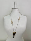 Necklace with heart-shaped pendants on a mannequin against a white background