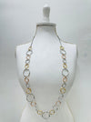 Necklace on a mannequin against a white background