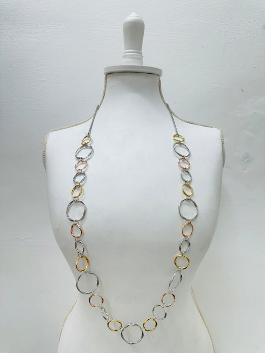 Necklace on a mannequin against a white background