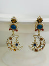 Dazzling gold drop earrings featuring moon and star motifs with pearls.