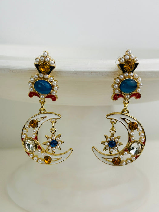 Dazzling gold drop earrings featuring moon and star motifs with pearls.