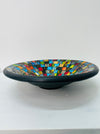 Side view of handmade mosaic Sterope bowl showing black terracotta base and multicoloured glass mosaic design.