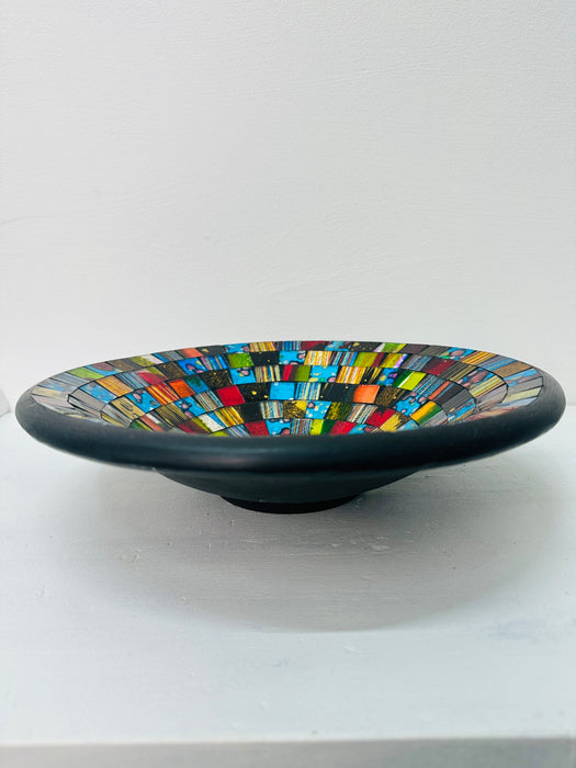 Side view of handmade mosaic Sterope bowl showing black terracotta base and multicoloured glass mosaic design.