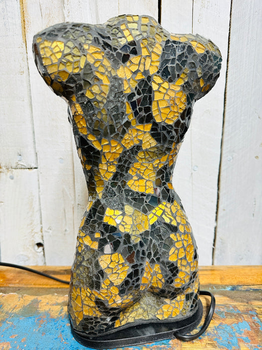 Side view of elegant bust lamp featuring hand-painted black and gold glass.