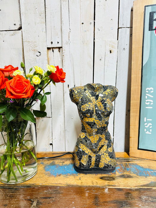 Front view of handcrafted black and gold mosaic bust lamp on fiberglass base.