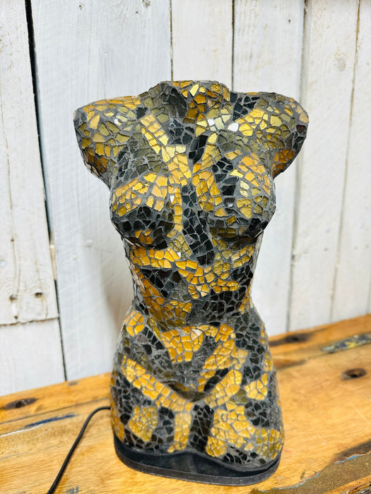 Side view of elegant bust lamp featuring hand-painted black and gold glass.