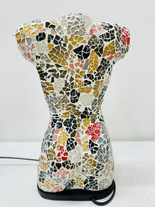 Back view of colourful mosaic bust lamp with geometric glass pattern.