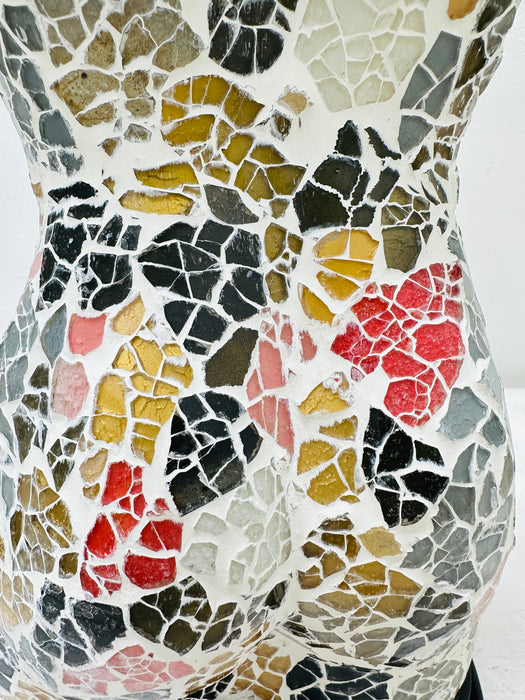 Close-up of hand-painted multi-colour mosaic glass pattern.